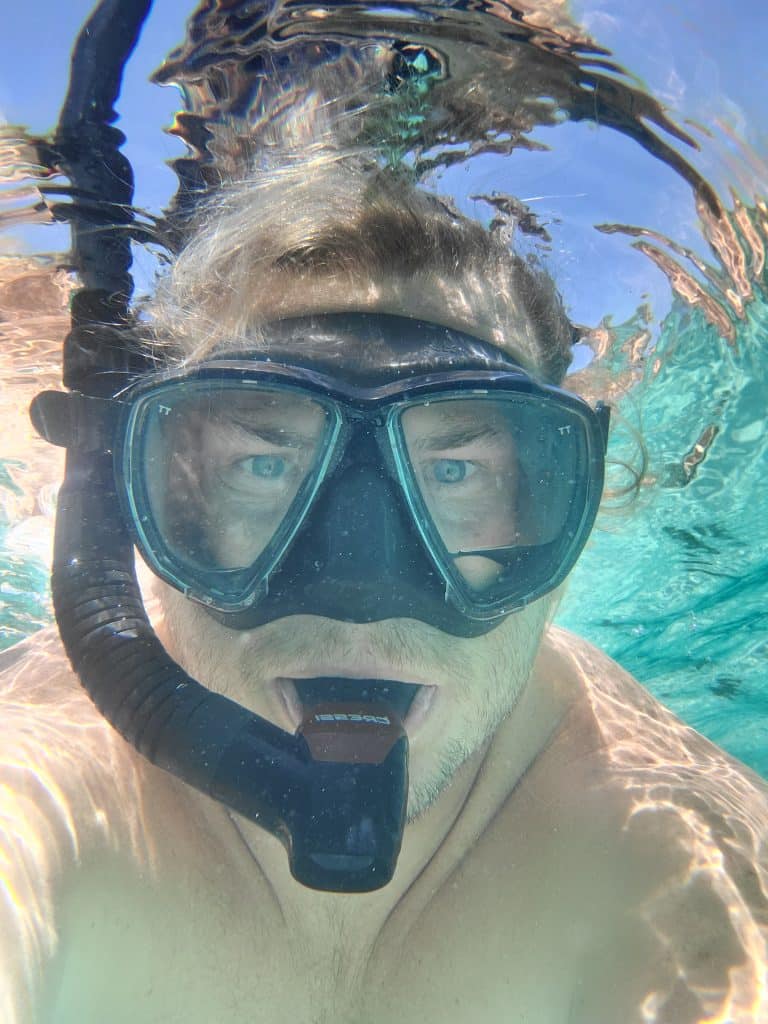 man snorkeling on a private boat tour with Anchor Charters in Panama City Florida