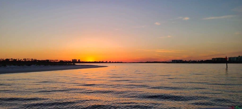 Sun setting against the bay in Panama City Florida